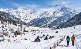 Delhi To Manali Tour Package 2026 with snow-covered mountains, Solang Valley adventure activities, and scenic Himalayan landscapes